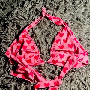 Pink top with red hearts.